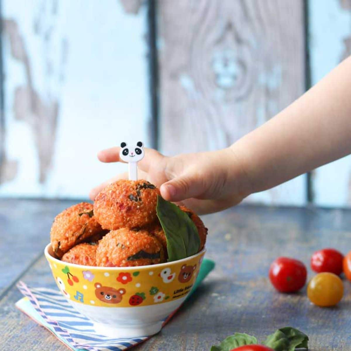 Crispy quinoa balls in a colorful bowl.