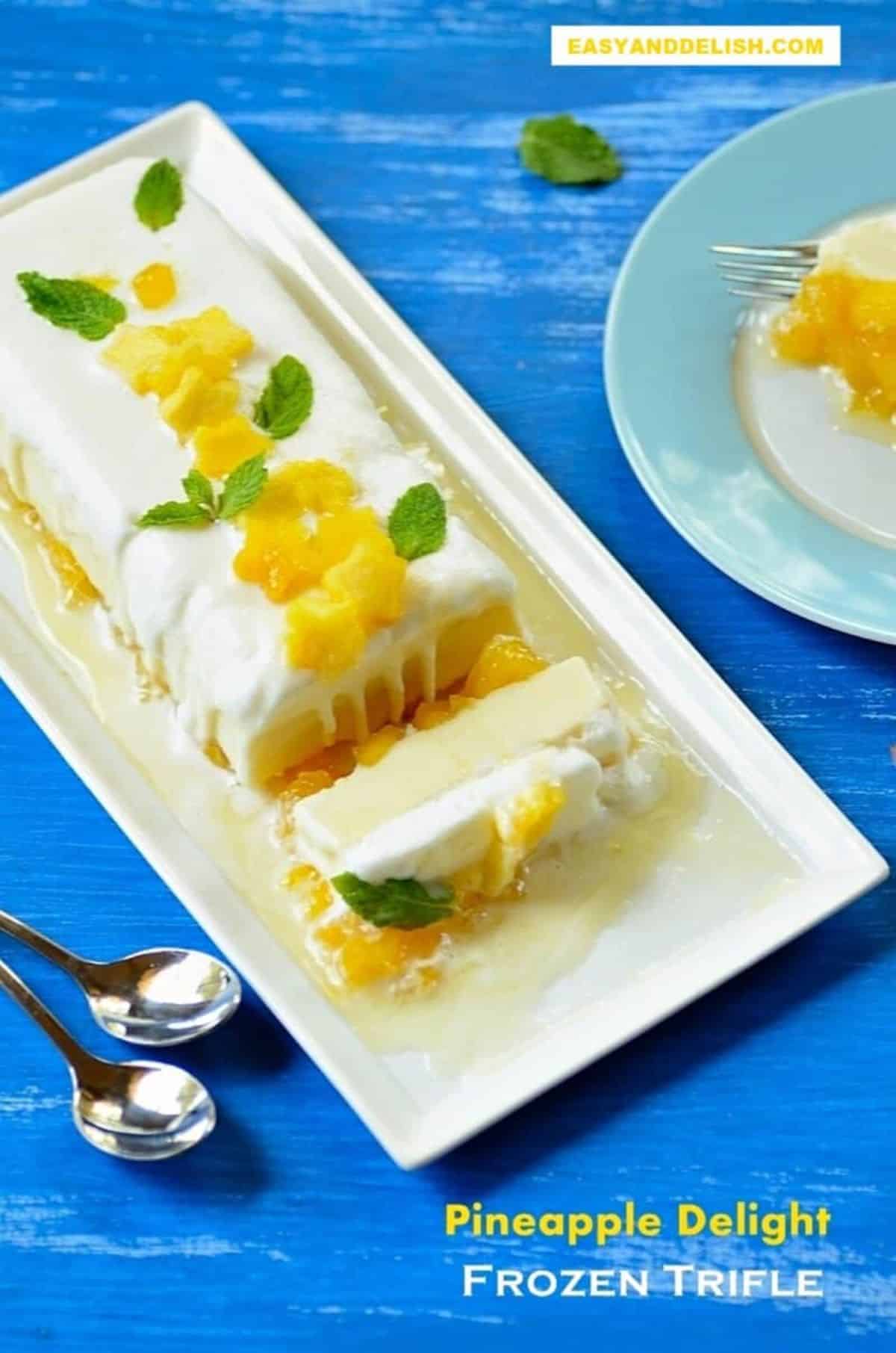 Scrumptious brazilian pineapple trifle on a white tray.