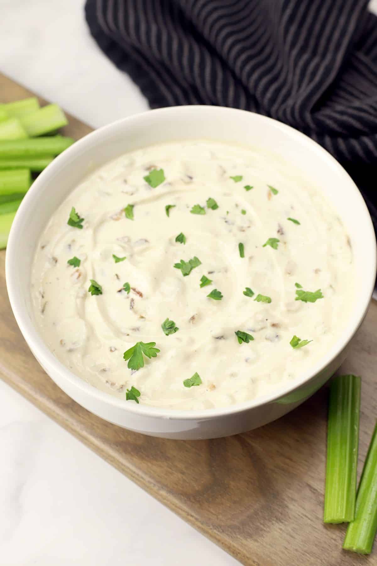 Creamy greek yogurt french onion dip in a white bowl.