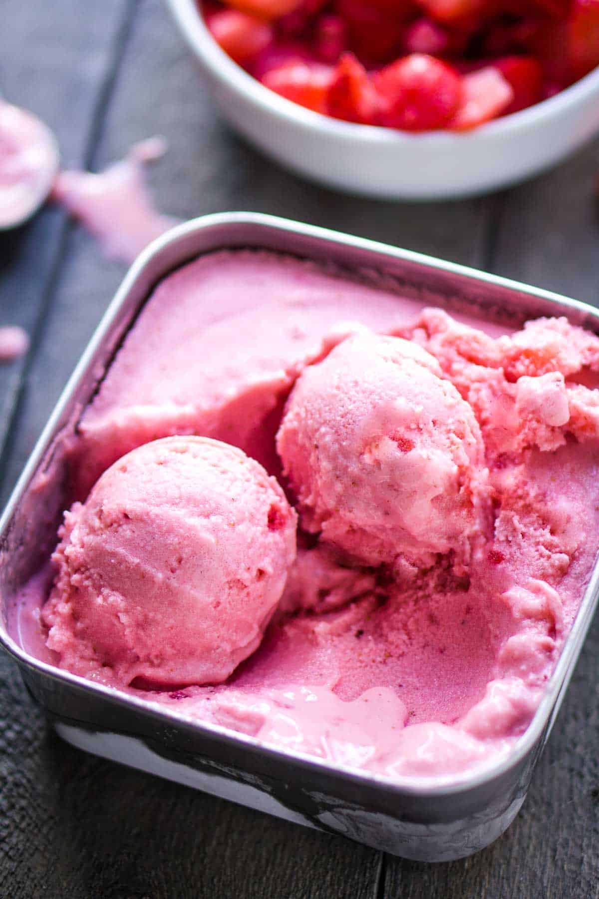 Mouth-watering strawberry frozen yogurt in a bowl.