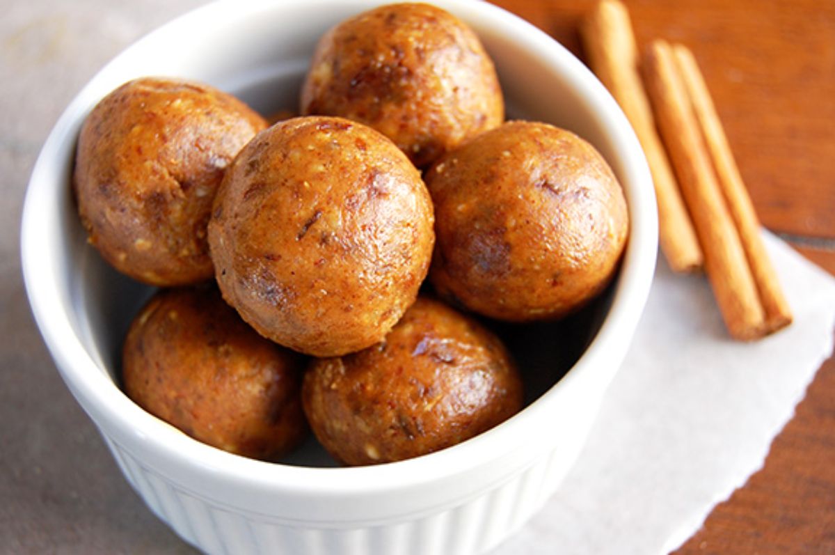 Delicious pumpkin pie energy bites in a white bowl.