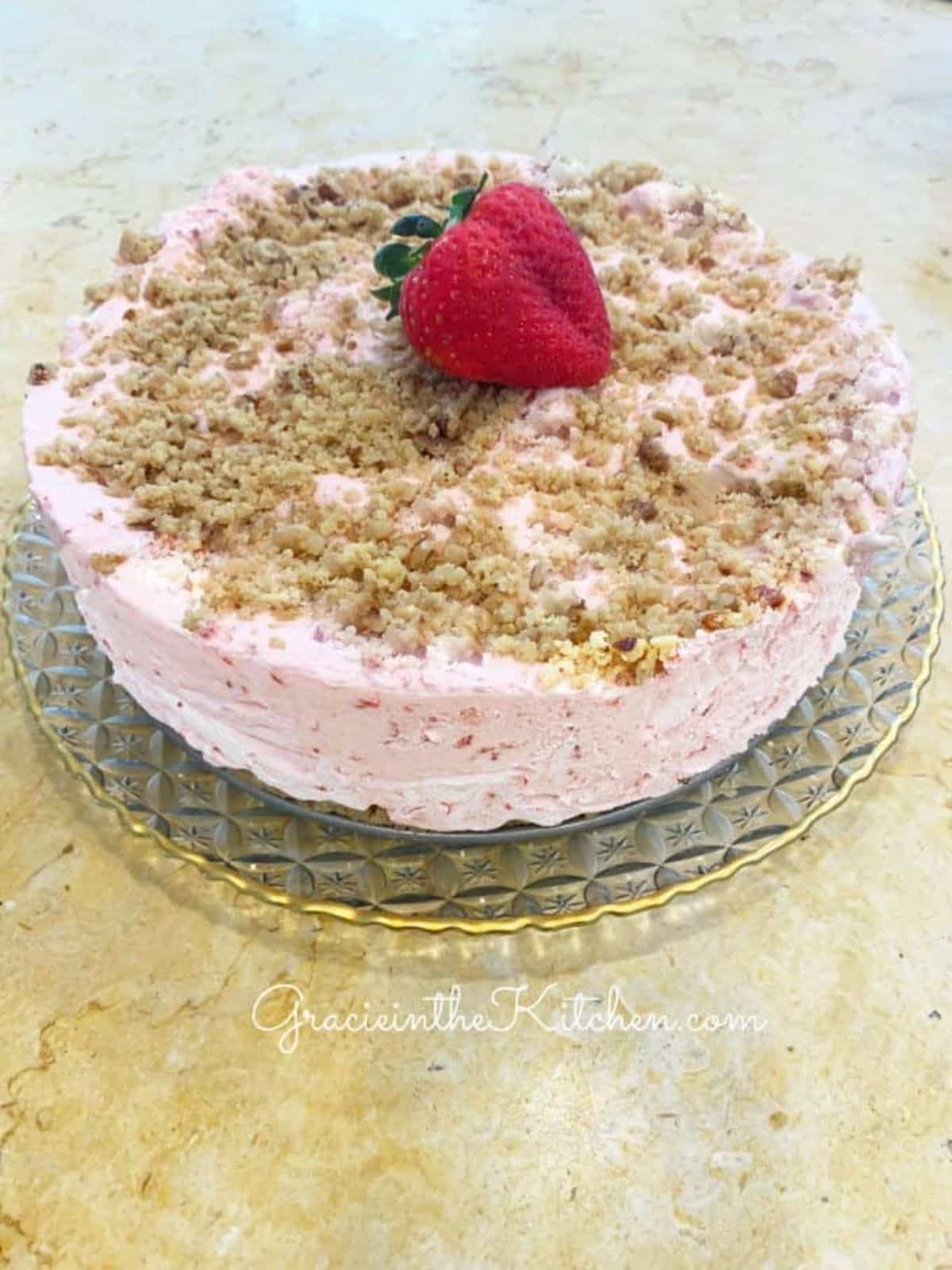 Delicious frozen strawberry delight on a cake tray.