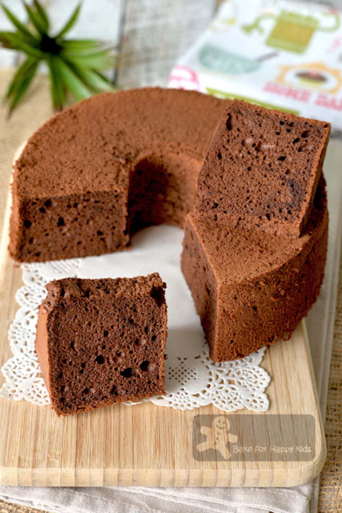 Scrumptious coffee cocoa egg white chiffon cake on a wooden tray.