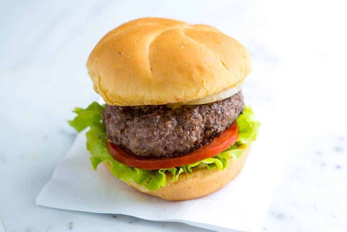 Delicious the best no-fuss hamburger on paper napkin.