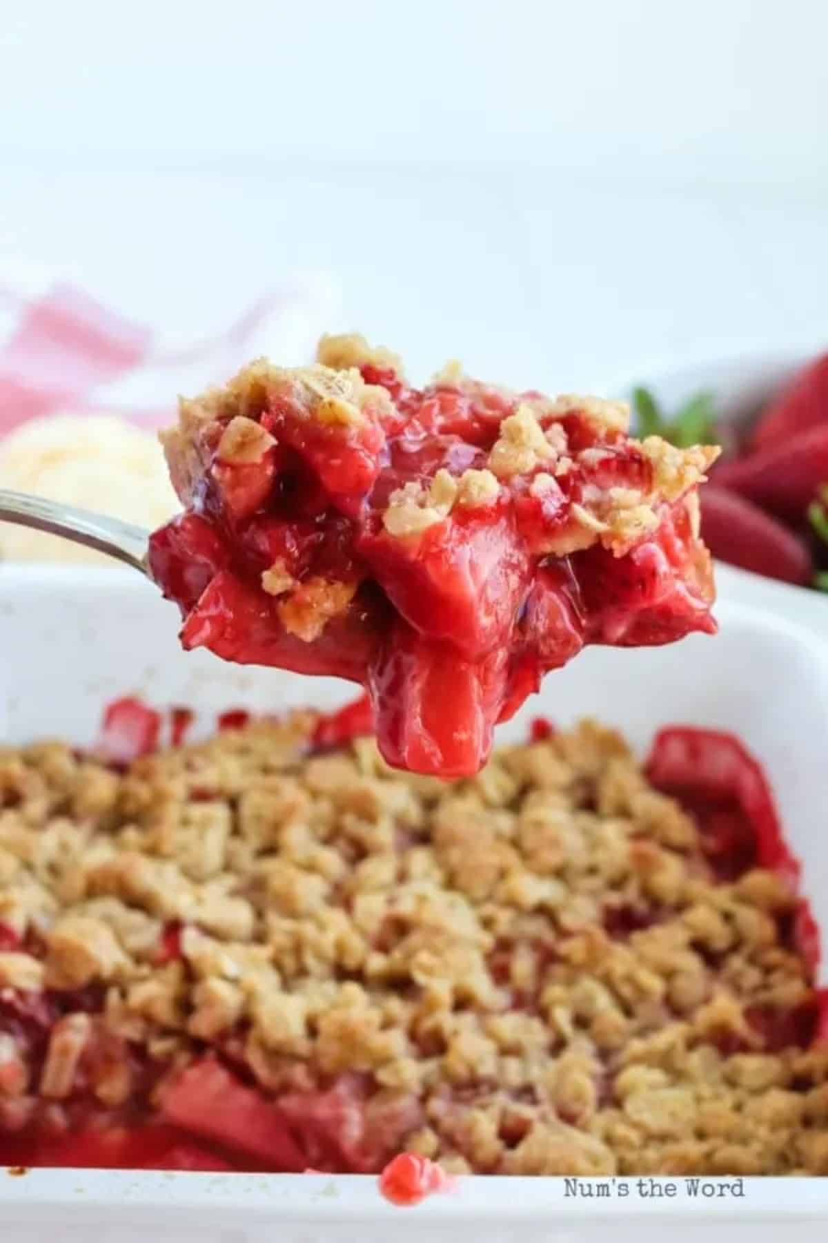 Scrumptious strawberry crisp on a spoon.