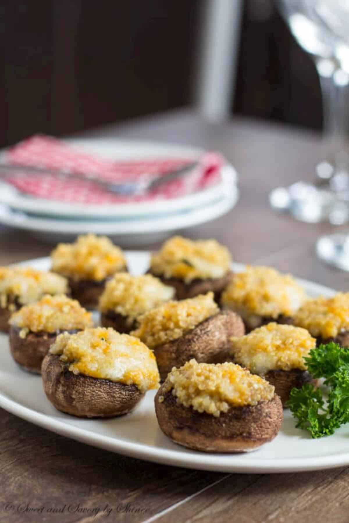 Scrumptious quinoa-stuffed mushrooms on a white tray.