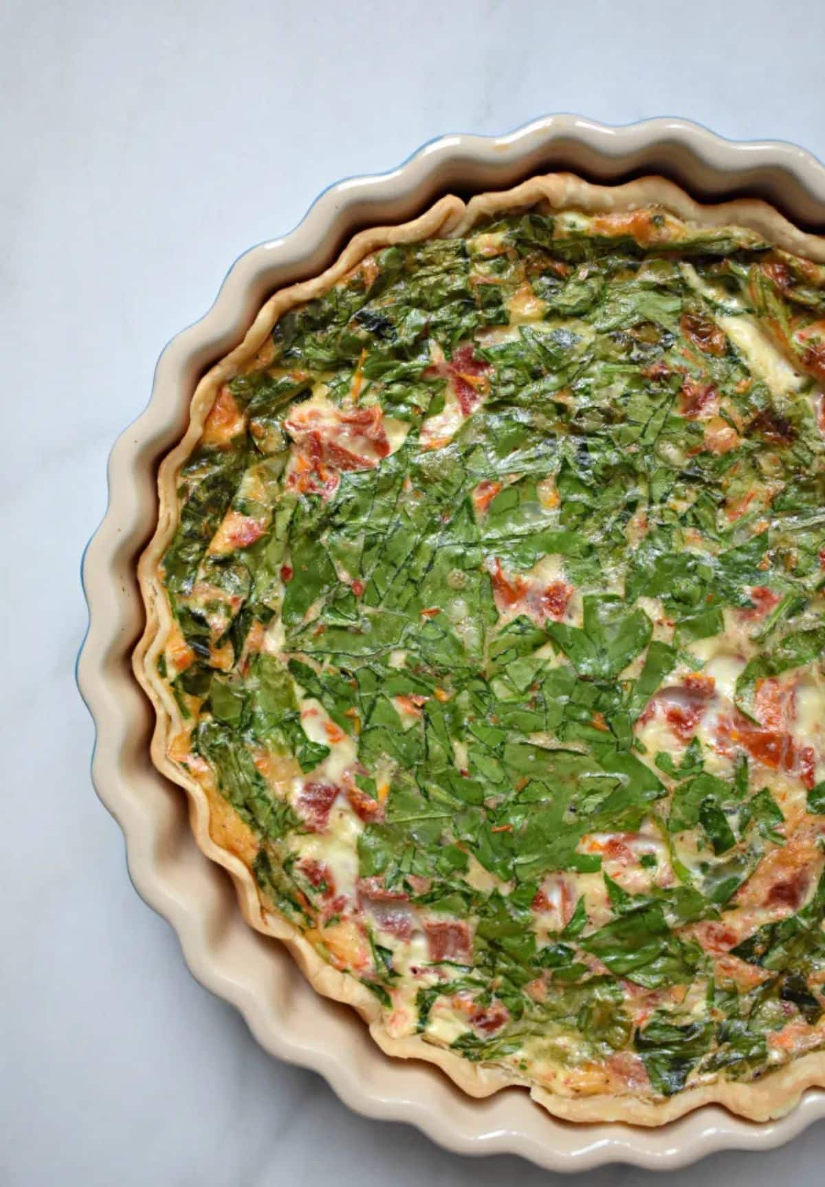 Flavorful mediterranean egg white quiche in a tray.