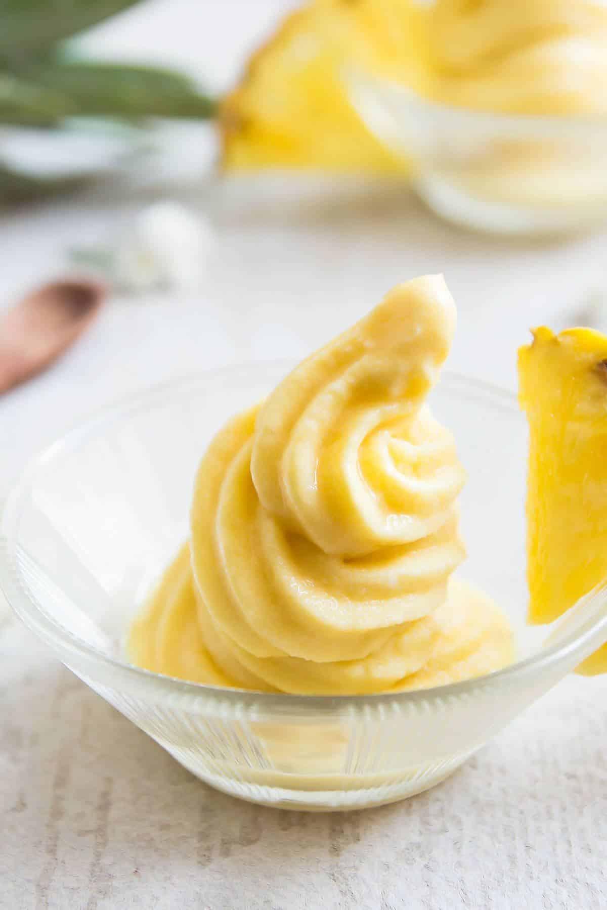 Fresh healthy dole pineapple whip in a glass bowl.