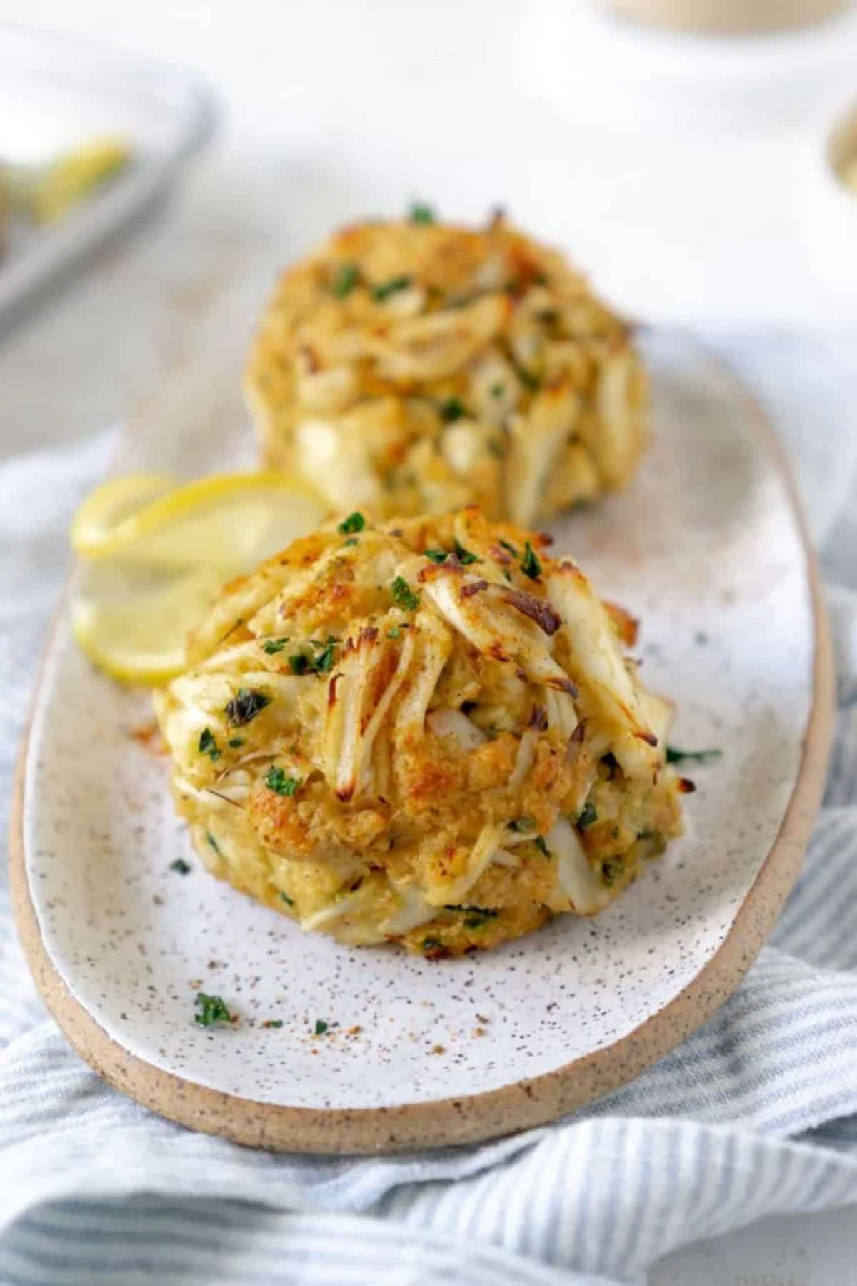 Scrumptious maryland crab cakes on a tray.