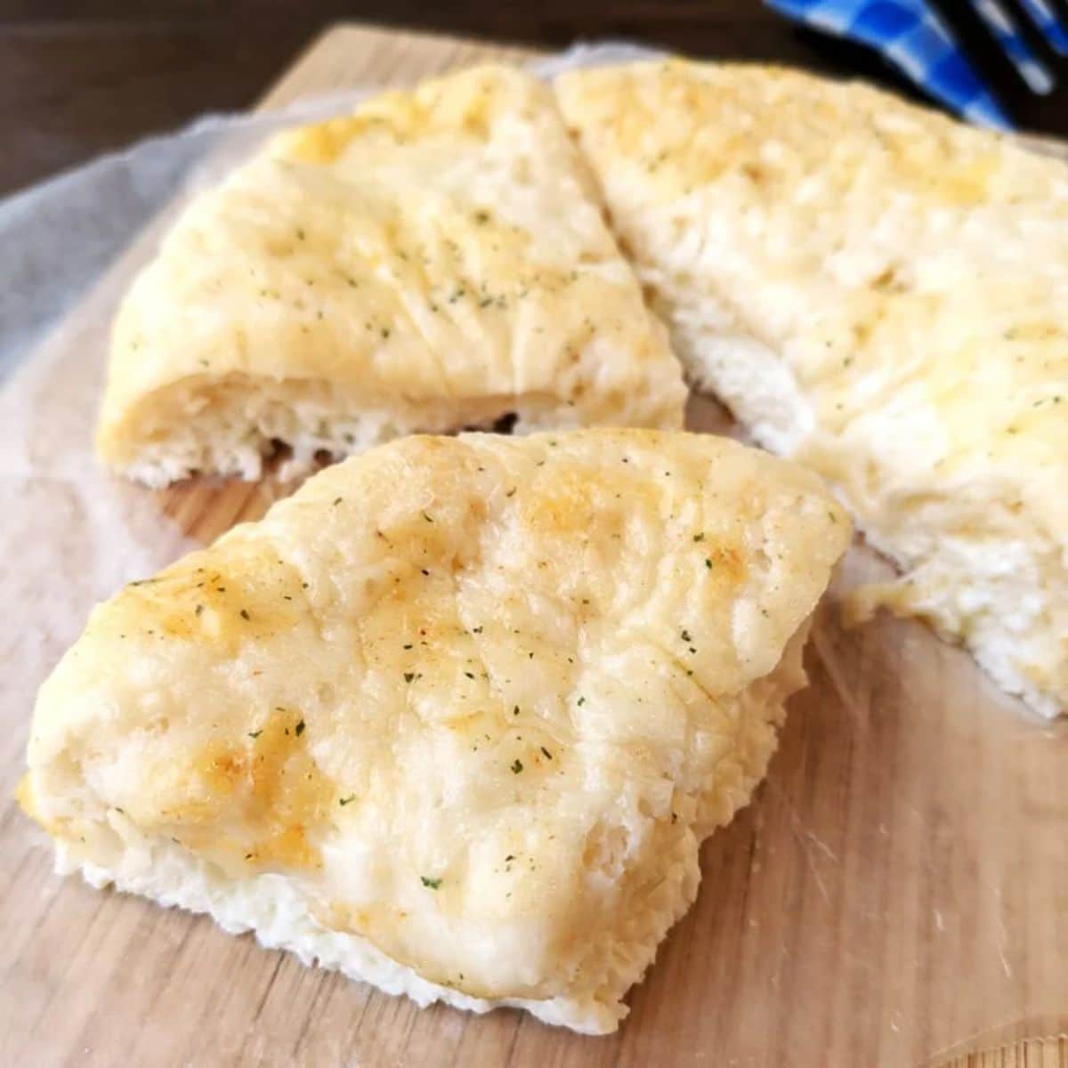 Flavorful egg white breakfast pizza on a wooden tray.