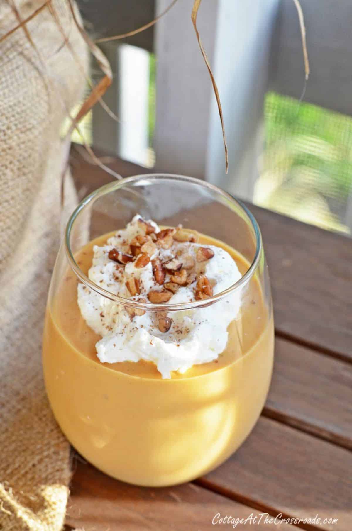 Healthy sweet potato pie smoothie in a glass cup.