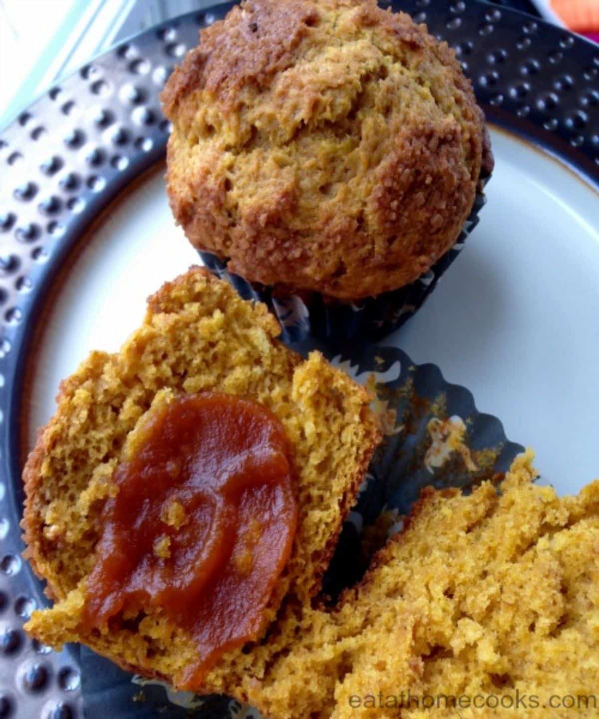 Scrumptious pumpkin butter muffins on a blue plate.