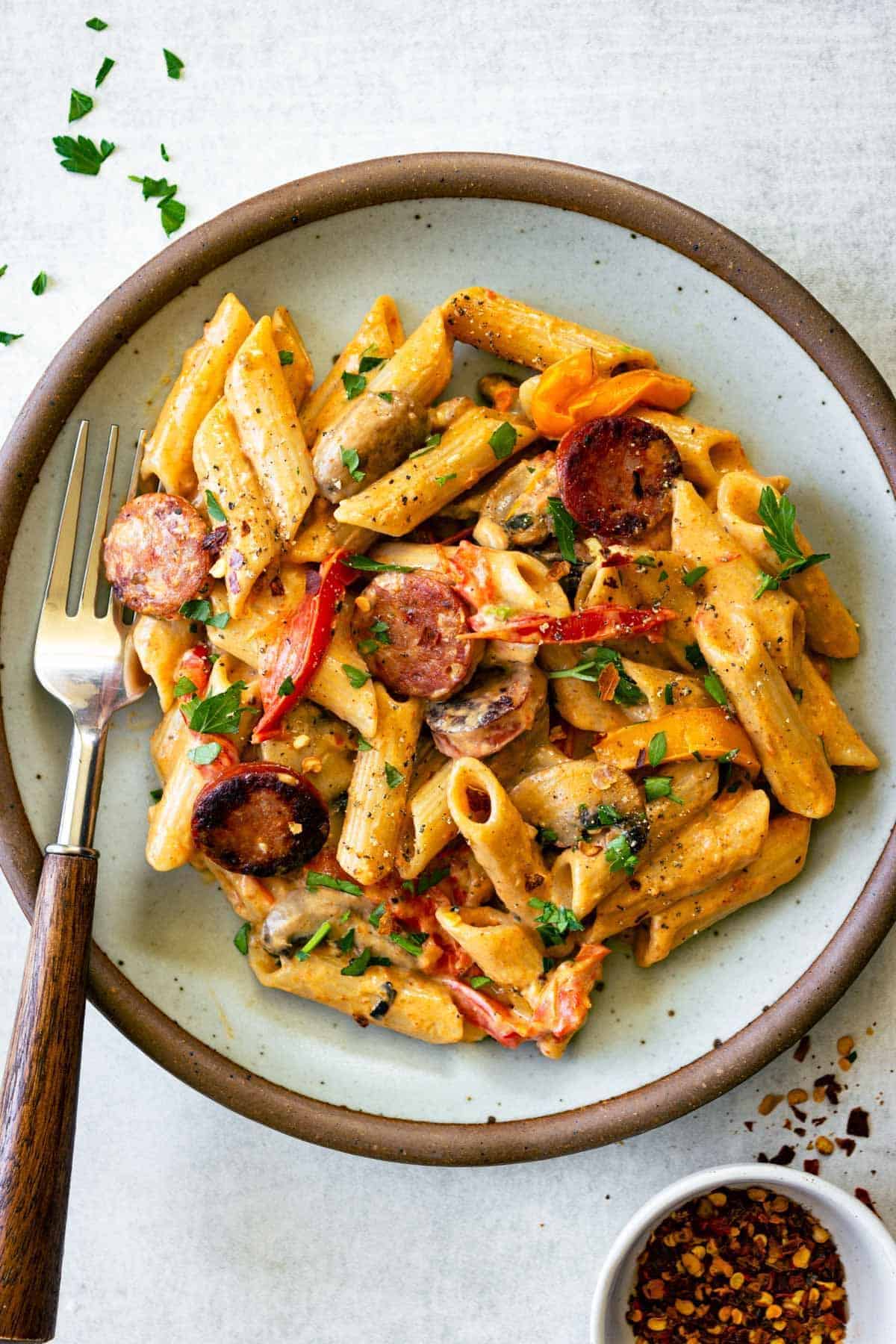 Healthy cajun pasta in a bowl with a fork.