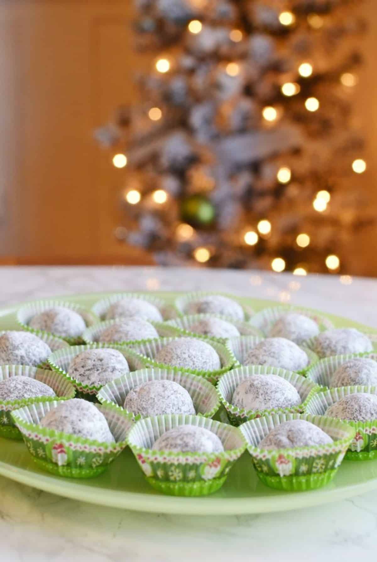 Tasteful mom’s rum balls on a green tray.