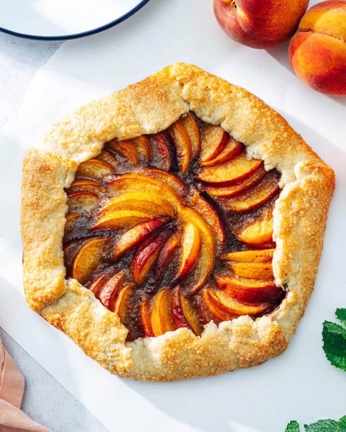 Mouth-watering peach galette on a table.