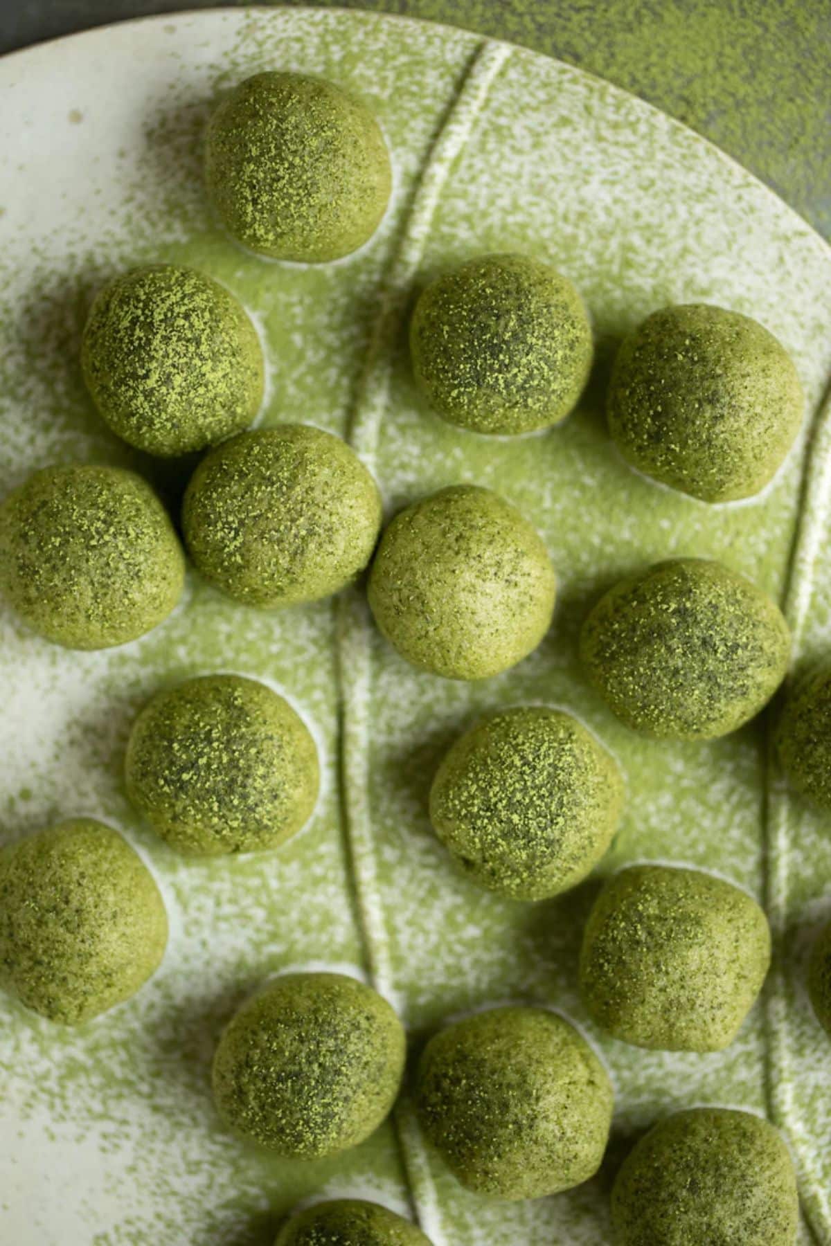 Tasty detox protein matcha balls on a plate.