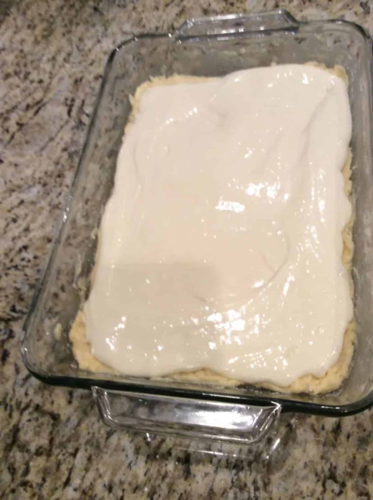 Creamy ugly cake in a glass casserole.