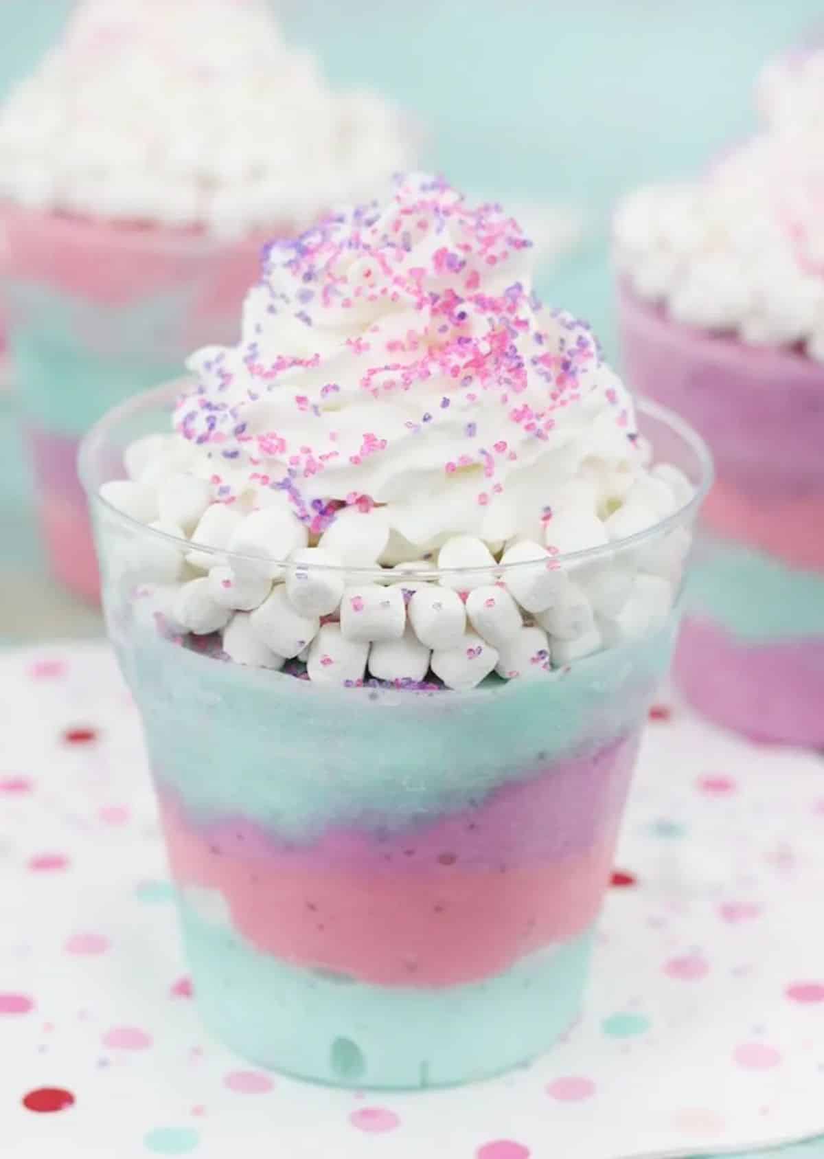 Delicious unicorn sundae in a glass cup.