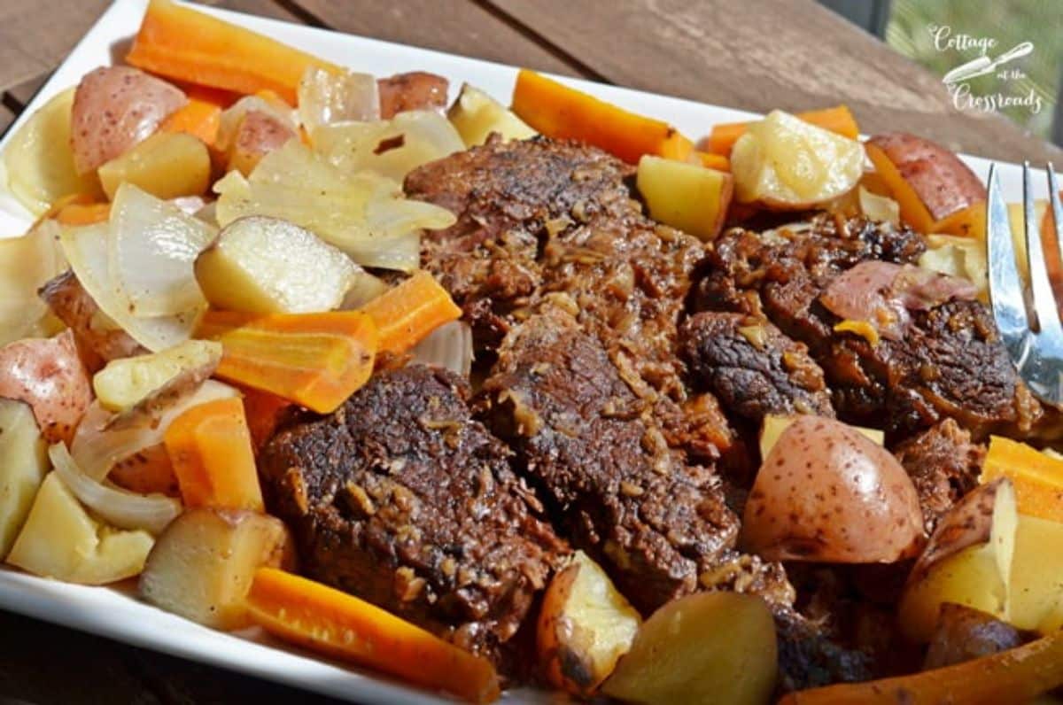 Delicious mom’s pot roast with bisonon a white tray.
