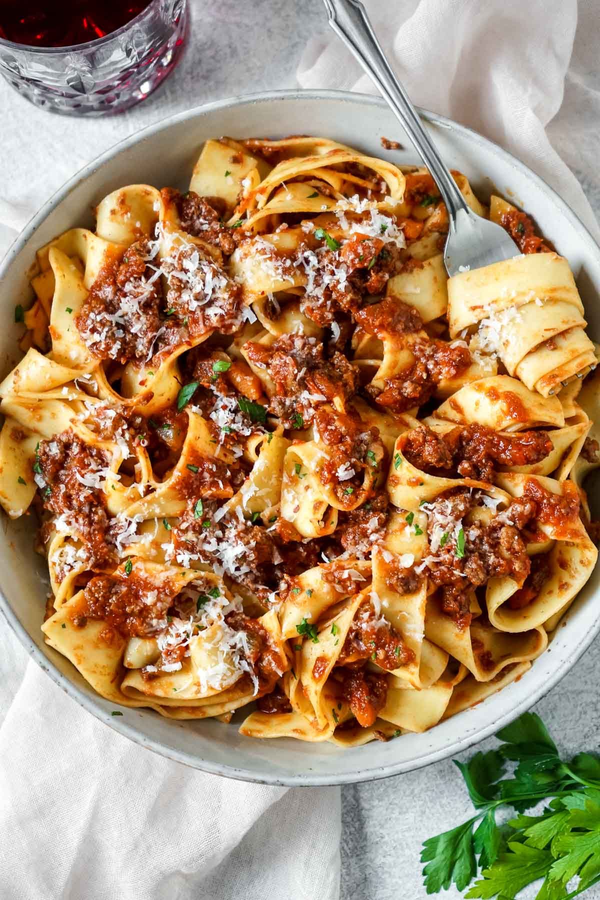 Easy slow cooker bison bolognese in a bowl with a fork.