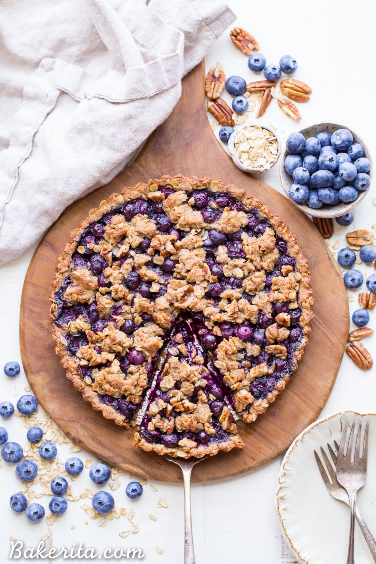 Delicious blueberry tart on a wooden tray.