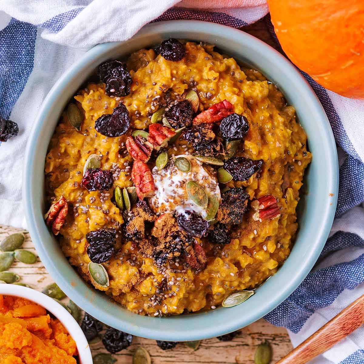 Delicious pumpkin porridge in a blue bowl.