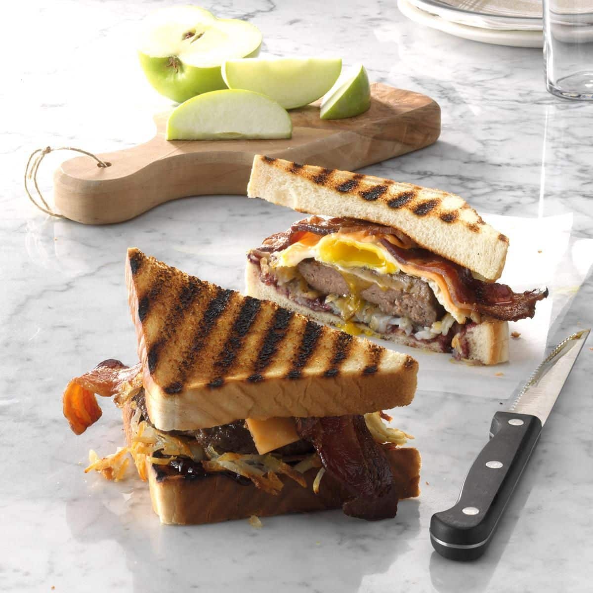 Sliced breakfast burger on a countertop.