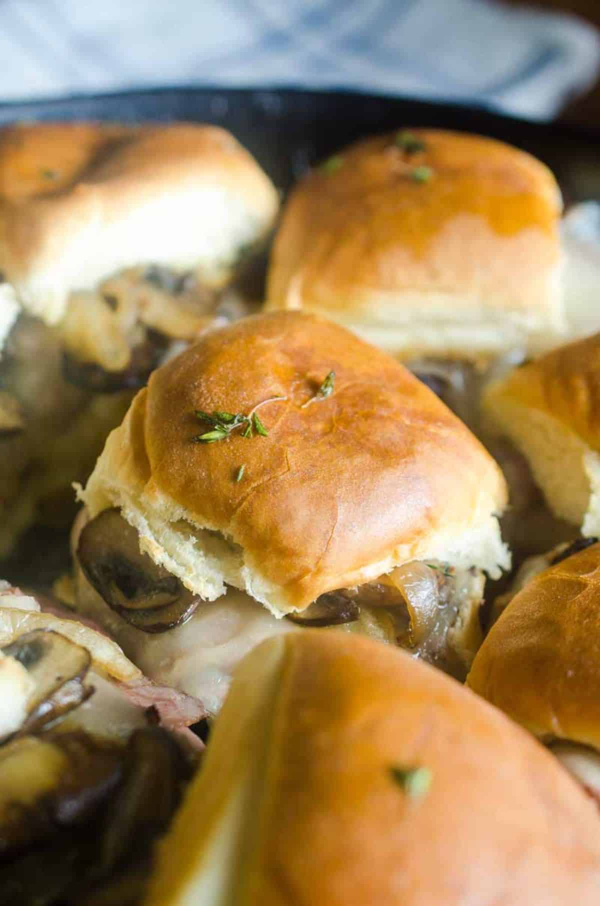 Flavorful roast beef mushroom sliders on a tray.