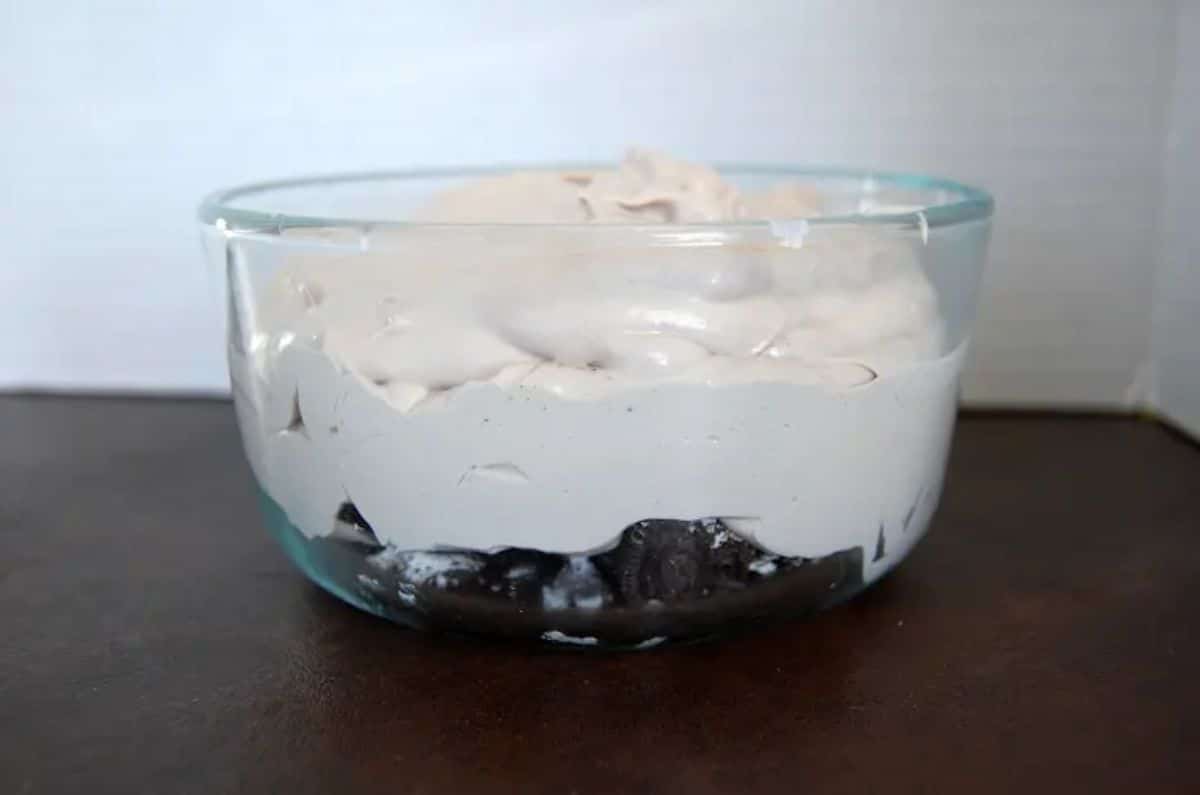 Mouth-watering kahlua oreo cheesecake dessert in a glass bowl.