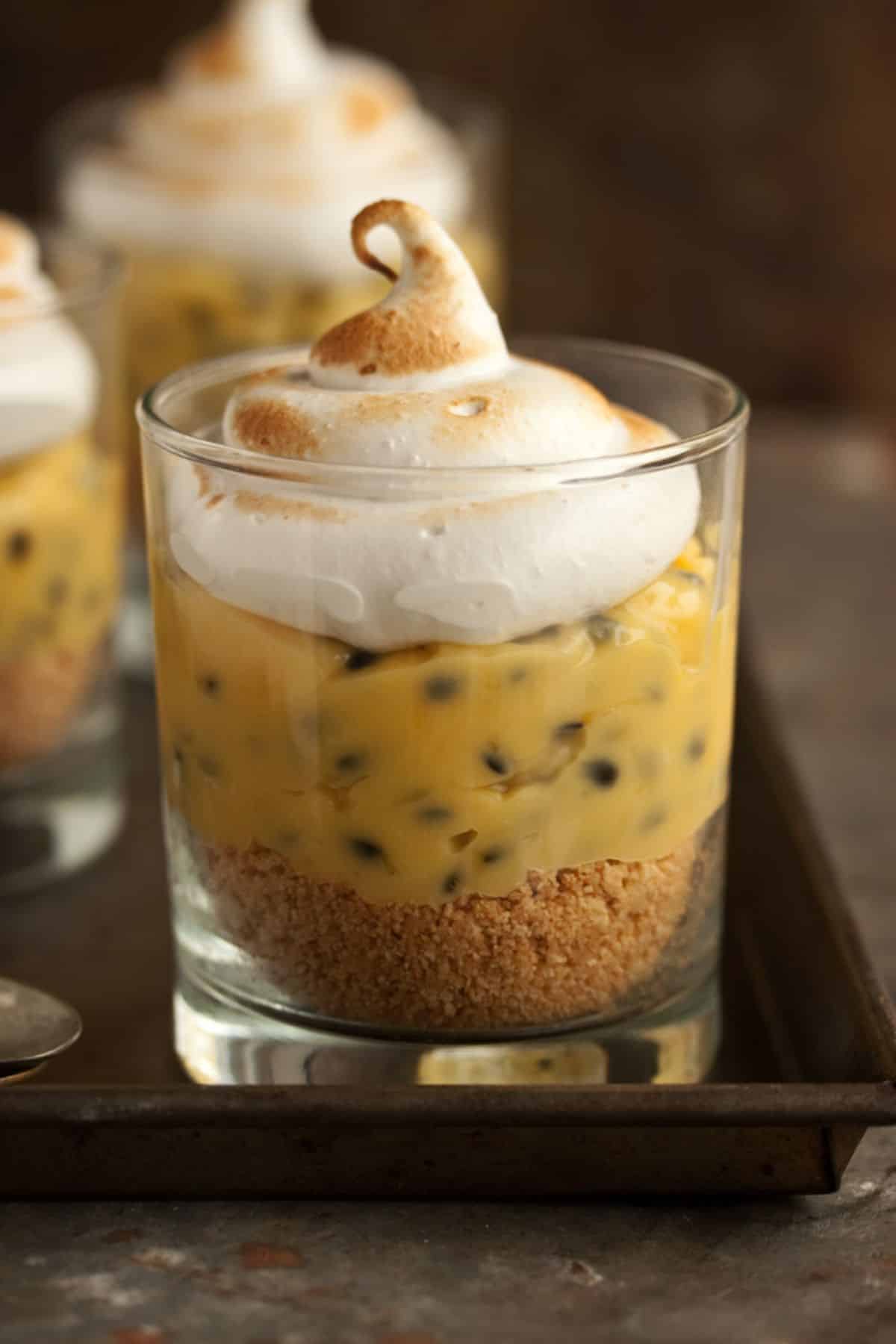 Mouth-watering passion fruit meringue pie in a glass cup.