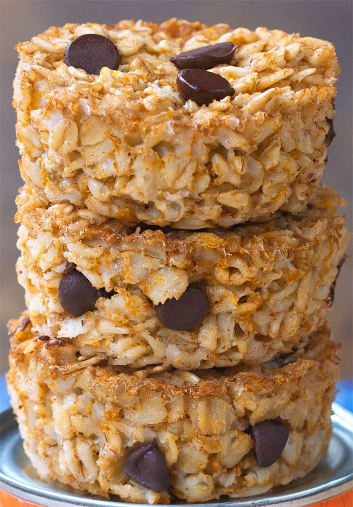 A pile of pumpkin oatmeal breakfast cupcakes on a small plate.