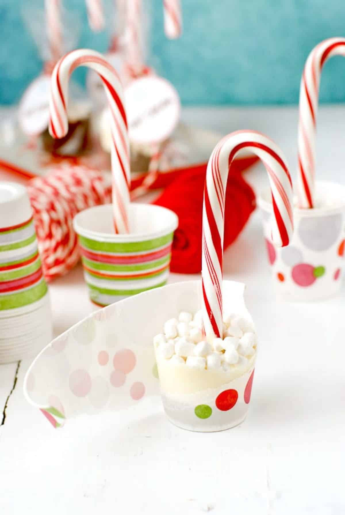 Tasty candy cane hot cocoa pops on a countertop.