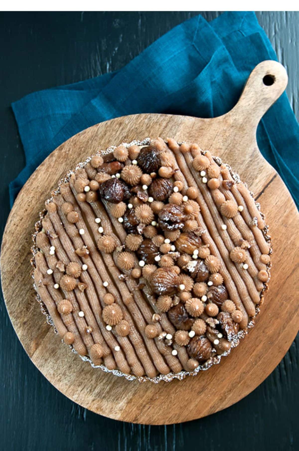 Delicious chestnut tart on a wooden tray.