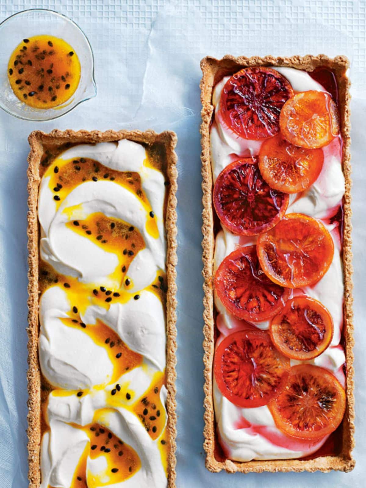 Scrumptious passion fruit ricotta tarts on a table.