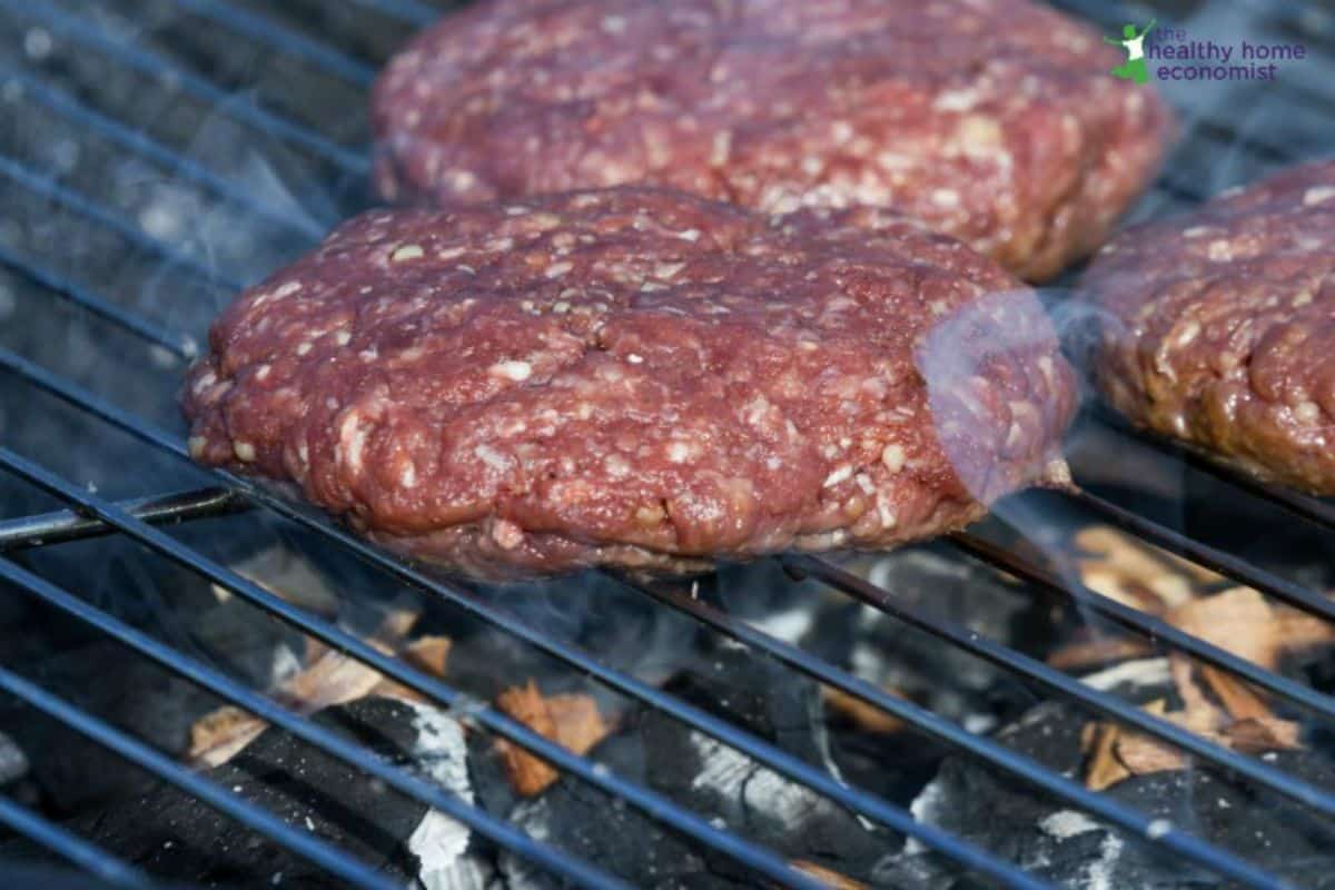 Juicy blueberry bison burgers on a grill.