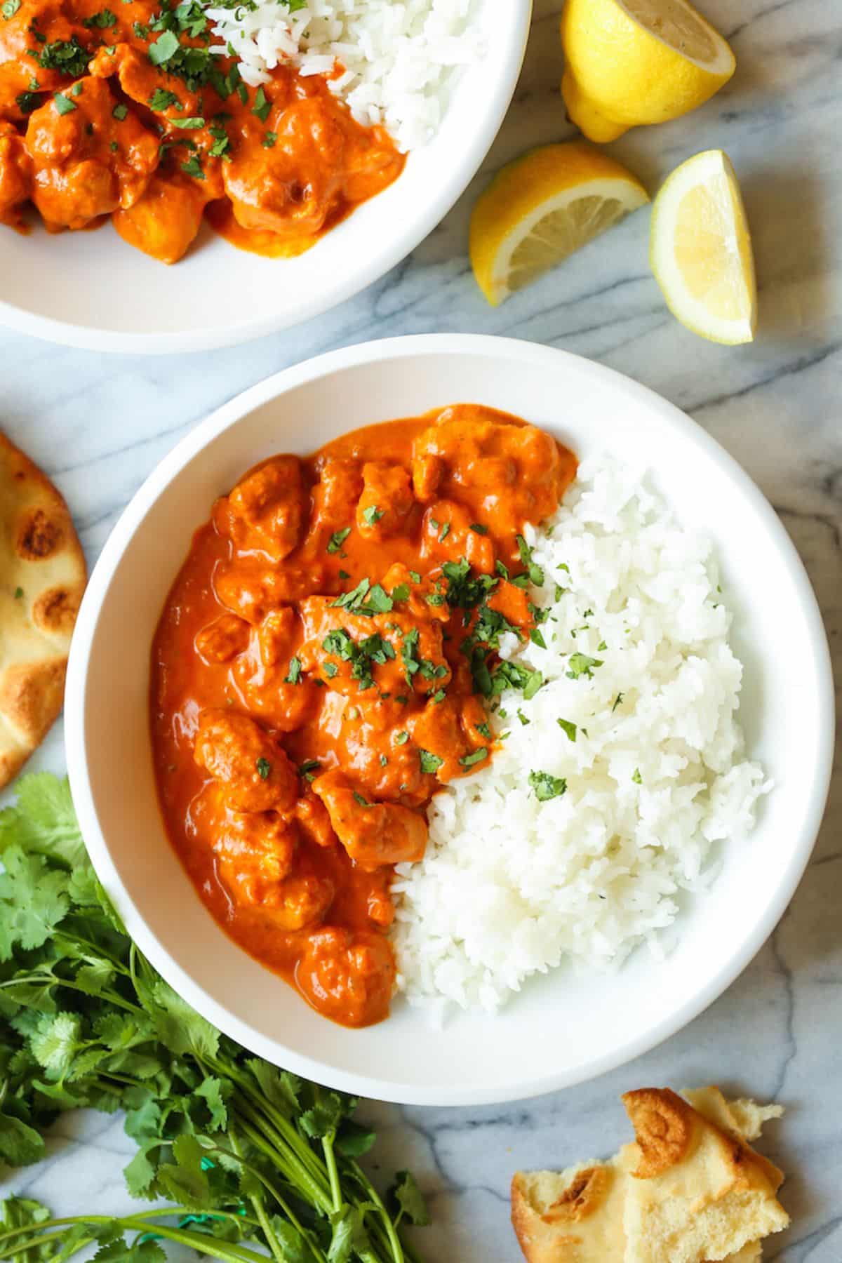 Juicy chicken tikka masala in a white bowl.