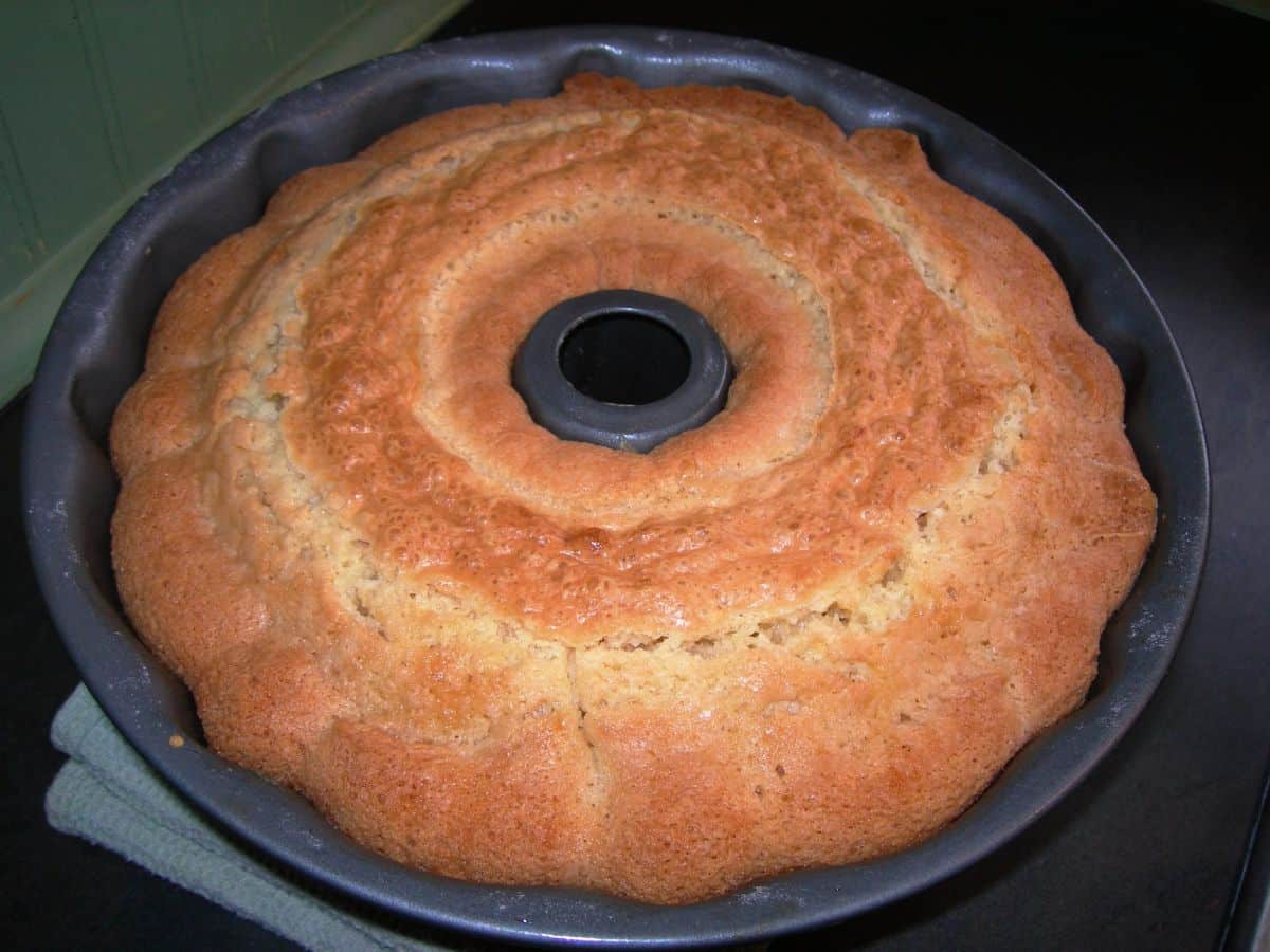 Flavorful sarah's pound cake in a cake baking traay.
