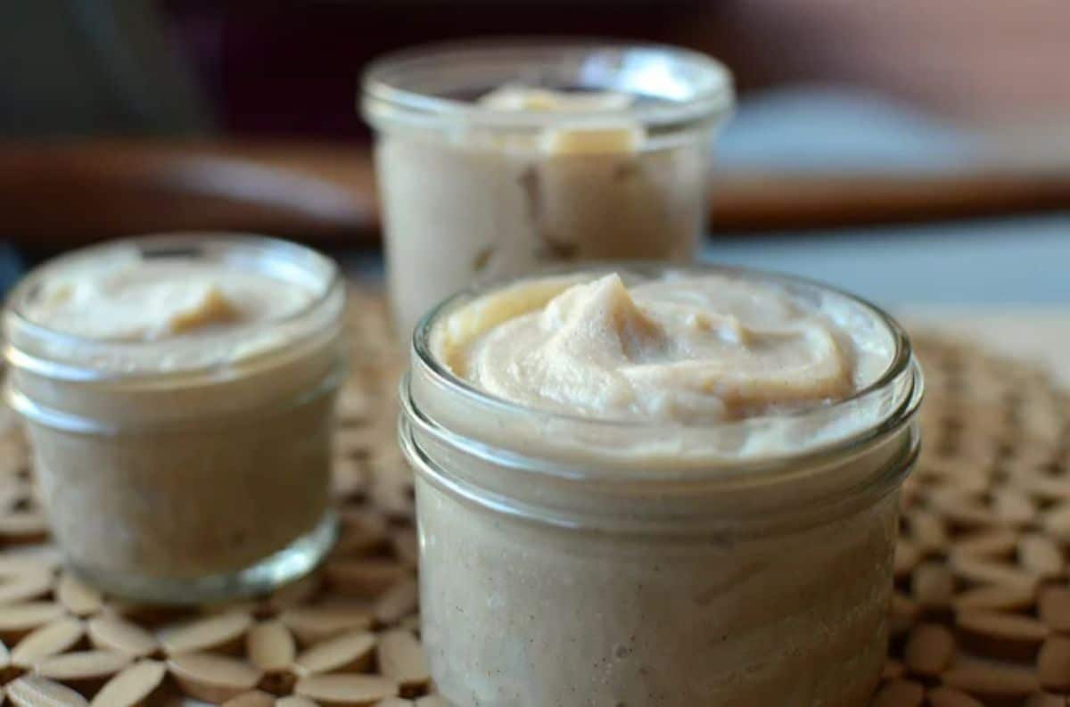 Creamy honey chestnut butter in glass jars.