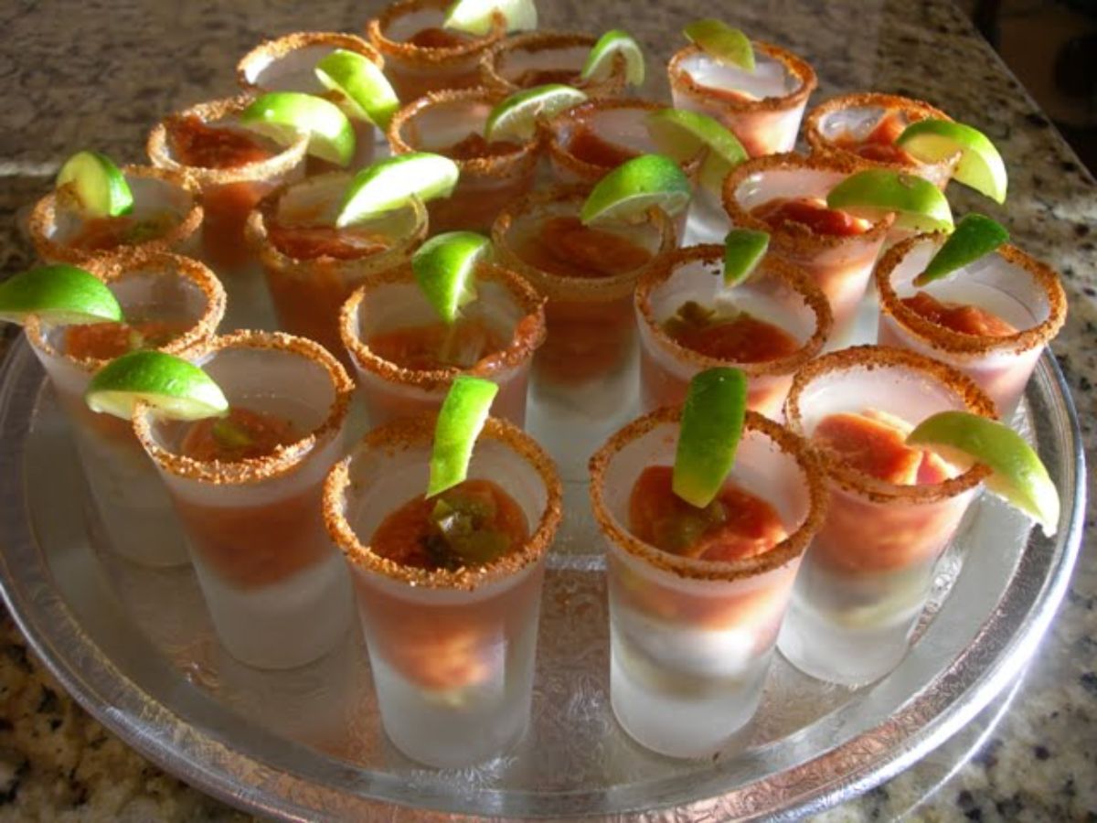 Flavorful oyster shooters on a tray.
