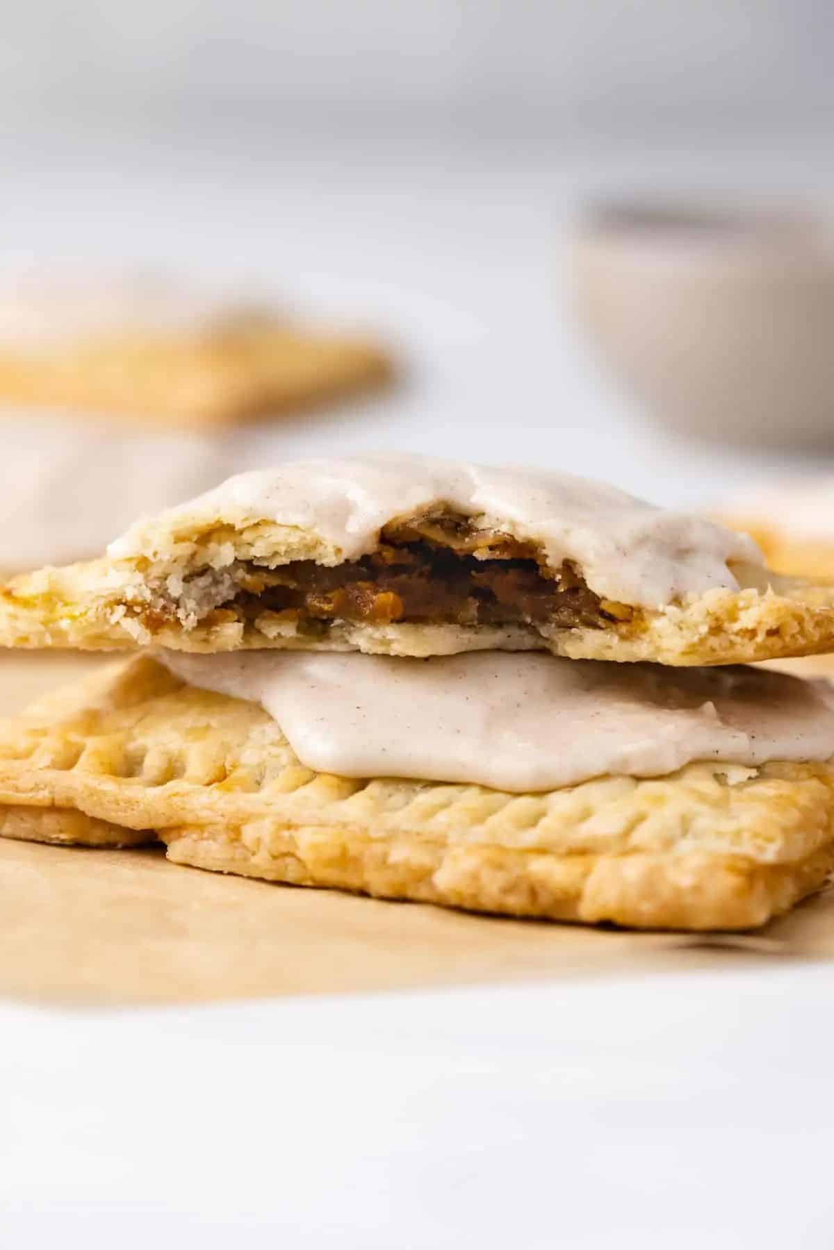 Crunchy pumpkin pie pop tarts on a table.