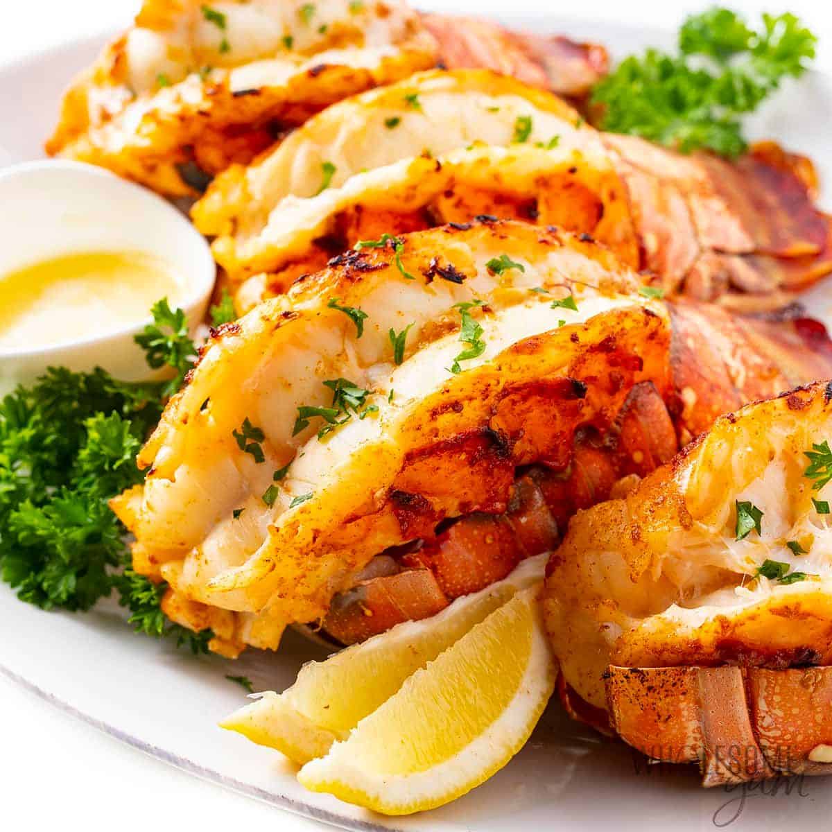 Mouth-watering broiled lobster tail on a tray.