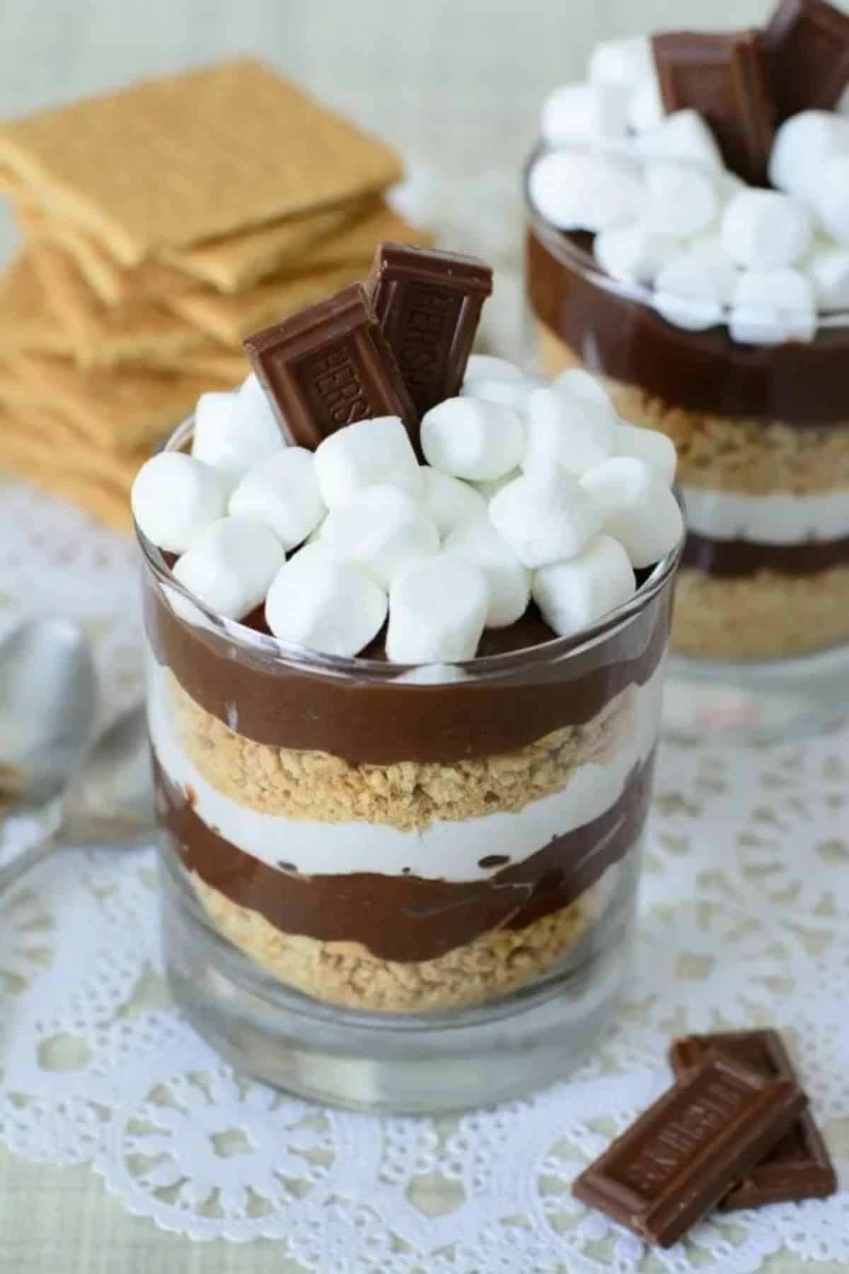 Mouth-watering easy no cook s’mores parfait in a glass cup.