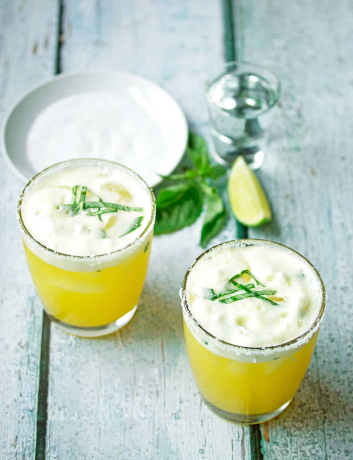 Fresh passion fruit margarita in glass cups.
