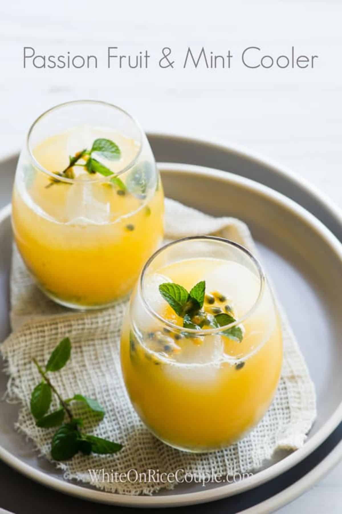Refreshing passion fruit cooler in glass cups on a tray.