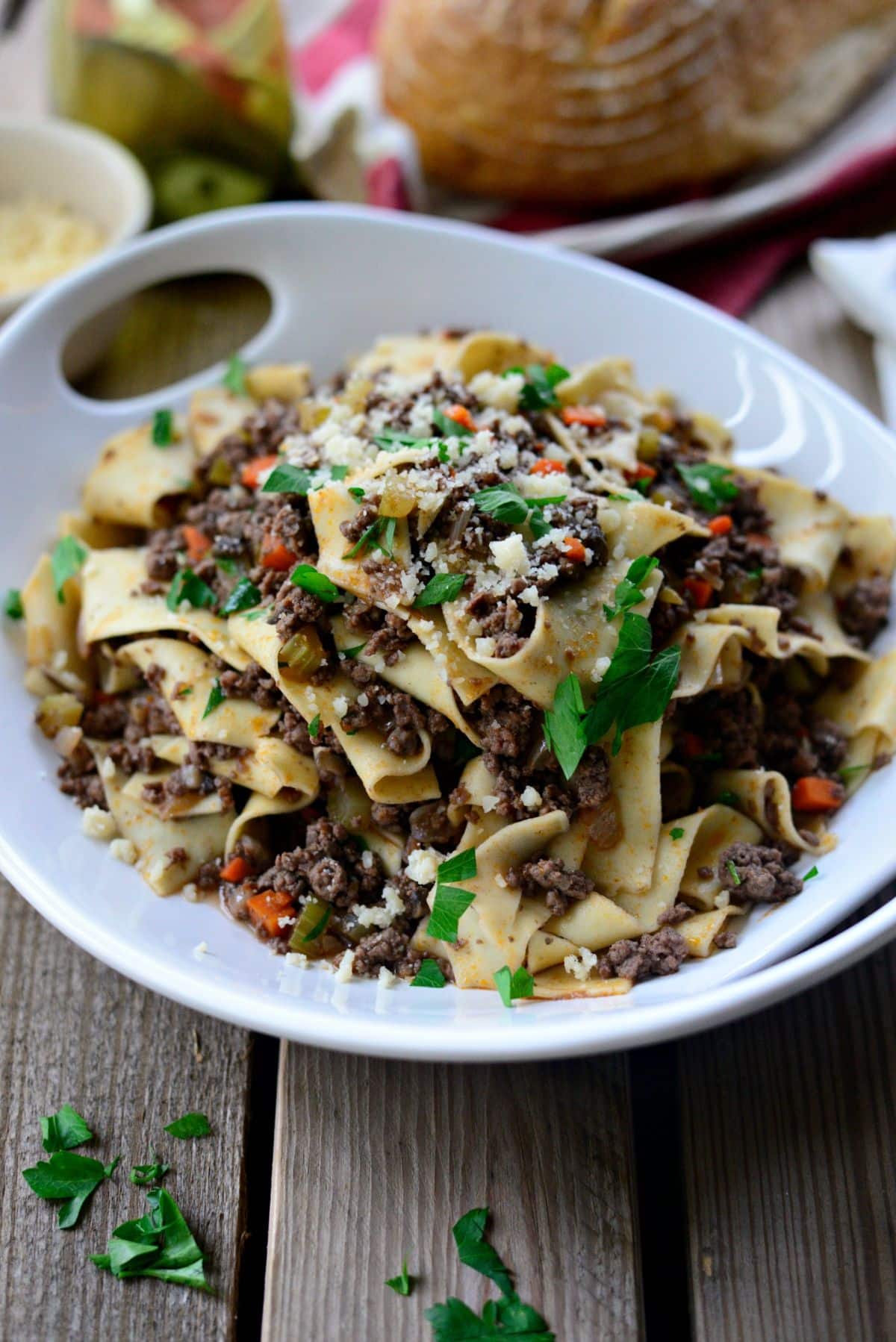 Flavorful venison mushroom pappardelle in a white bowl.