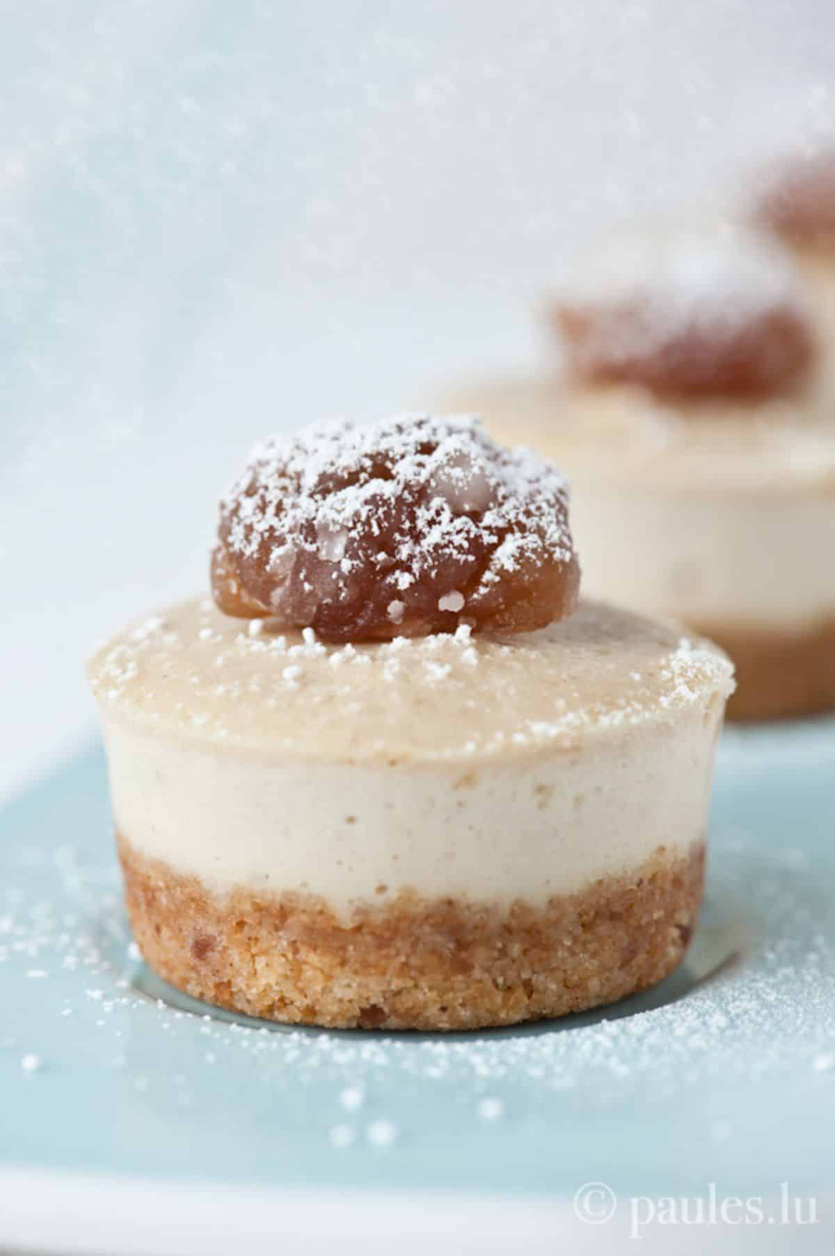 Mouth-watering mini-maronen cheesecakes on a blue tray.