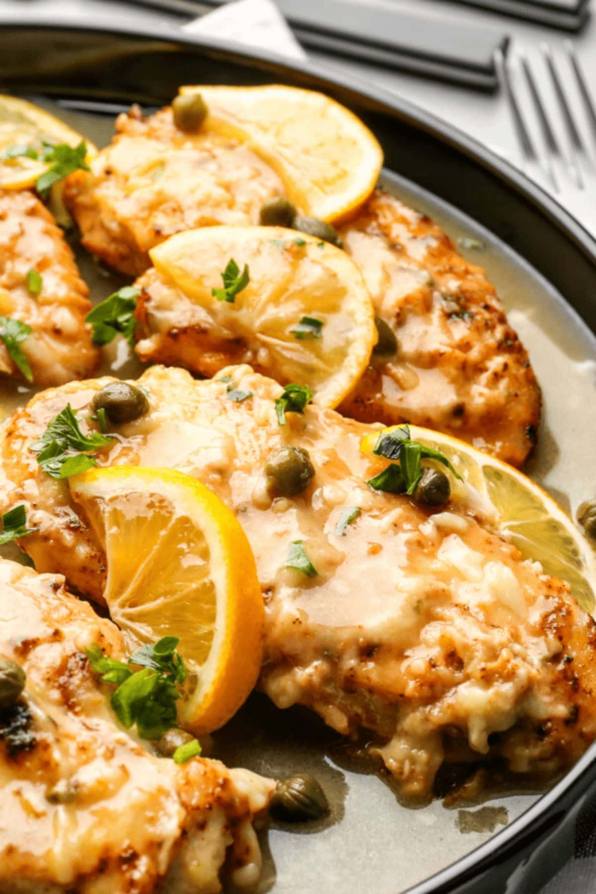 Chicken chicken piccata in a skillet.