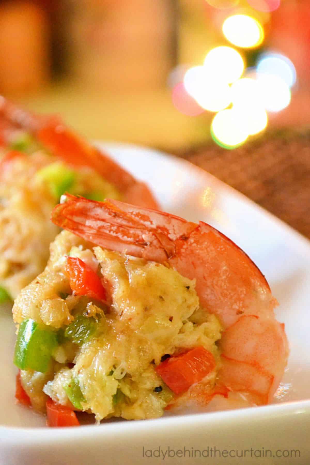 Juicy crab cake stuffed shrimp in a white bowl.