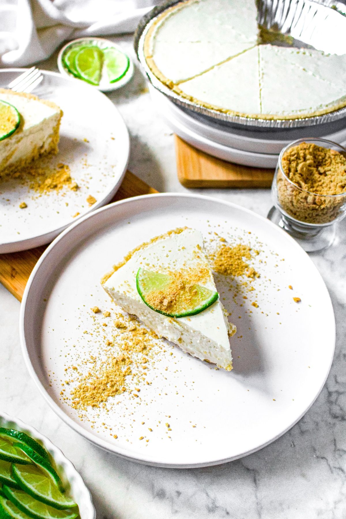 A piece of creamy no-bake dairy free key lime pie on a white plate.