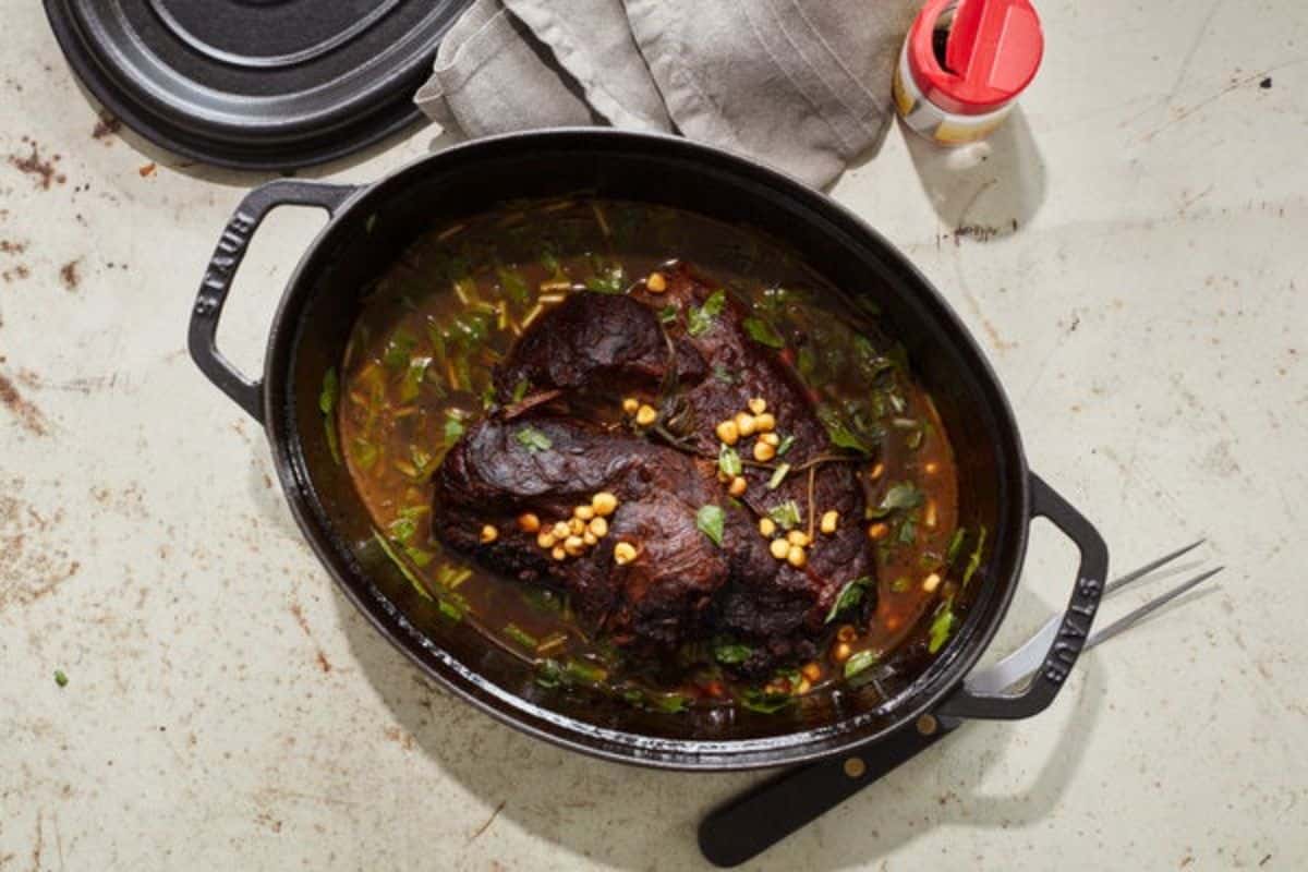 Juicy bison pot roast on a casserole.